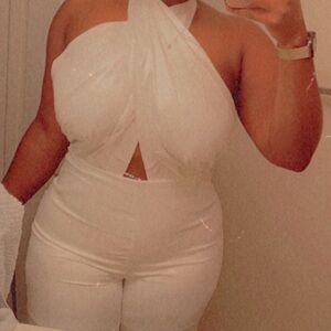 White jumpsuit large with split ends at the legs. Open back. Satin white.
